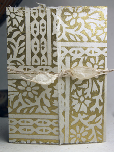 invitation shell with golden woodcut print and eco-twist wrap